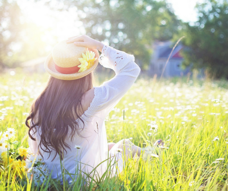 woman sitting in a meadow